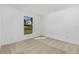 Spacious bedroom with neutral carpeting and large window offering natural light at 4600 Kempson Ln, Port Charlotte, FL 33981