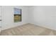 Bright bedroom with neutral carpeting and window with blinds at 4600 Kempson Ln, Port Charlotte, FL 33981