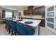 Modern kitchen with island, stainless steel appliances, and dark cabinetry at 10194 Gliding Eagle Way, Land O Lakes, FL 34638