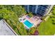 Aerial view of resort-style pool, deck, and surrounding landscape at 2413 Bayshore Blvd # 2004, Tampa, FL 33629