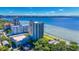 Aerial view of a high-rise condo building located on the waterfront, showcasing its prime location at 2413 Bayshore Blvd # 2004, Tampa, FL 33629