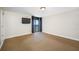 Bedroom with balcony access and wall-mounted TV at 2413 Bayshore Blvd # 2004, Tampa, FL 33629