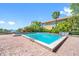 Community pool with brick patio and ocean view at 2413 Bayshore Blvd # 2004, Tampa, FL 33629