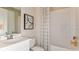Clean bathroom with a shower/tub combo and white vanity at 10575 Piedra Dr, Palmetto, FL 34221