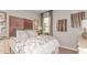 Charming bedroom with a blush-colored headboard and butterfly artwork at 10575 Piedra Dr, Palmetto, FL 34221