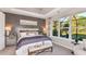 Spacious main bedroom with large windows and sitting area at 10575 Piedra Dr, Palmetto, FL 34221