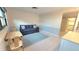 Small living room with sofa, table, and closet at 1400 1St W Ave # 103, Bradenton, FL 34205