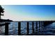 Serene waterfront view with pilings and calm waters at 1400 1St W Ave # 103, Bradenton, FL 34205