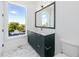 Contemporary bathroom with marble flooring and a modern vanity at 1308 E Columbus Dr # 1, Tampa, FL 33605