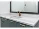Green vanity with quartz countertop and gold hardware at 1308 E Columbus Dr # 1, Tampa, FL 33605