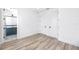 Spacious bedroom with an ensuite bathroom and wood-look flooring at 1308 E Columbus Dr # 1, Tampa, FL 33605