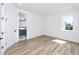 Light and airy bedroom with an ensuite bathroom and wood-look flooring at 1308 E Columbus Dr # 1, Tampa, FL 33605