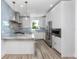 Modern kitchen with granite countertops and stainless steel appliances at 1308 E Columbus Dr # 1, Tampa, FL 33605