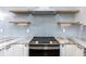 Modern kitchen with stainless steel range and backsplash at 1308 E Columbus Dr # 1, Tampa, FL 33605