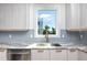 Modern kitchen with sink and stainless steel dishwasher at 1308 E Columbus Dr # 1, Tampa, FL 33605