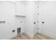 Clean laundry room with white cabinets and modern fixtures at 1308 E Columbus Dr # 1, Tampa, FL 33605