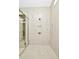 Large walk-in shower with modern tile and fixtures at 32298 Wetland Bird Vw, San Antonio, FL 33576