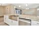 Kitchen island with farmhouse sink and granite countertops at 32298 Wetland Bird Vw, San Antonio, FL 33576