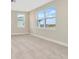 Bright bedroom with large windows and carpet at 32298 Wetland Bird Vw, San Antonio, FL 33576