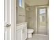 Bathroom with white vanity, toilet and large shower at 32298 Wetland Bird Vw, San Antonio, FL 33576