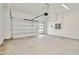 Spacious garage with automatic door and ample storage at 32298 Wetland Bird Vw, San Antonio, FL 33576