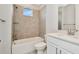 Bathroom with tub, shower, and white vanity at 32298 Wetland Bird Vw, San Antonio, FL 33576