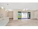 Open concept living area with sliding doors leading to patio at 32298 Wetland Bird Vw, San Antonio, FL 33576