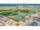 Aerial view of community with lake, conservation, and new homes at 32298 Wetland Bird Vw, San Antonio, FL 33576