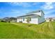 Modern house exterior with white walls and a grassy yard at 32298 Wetland Bird Vw, San Antonio, FL 33576
