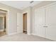 Spacious bedroom with double doors and hallway access at 32298 Wetland Bird Vw, San Antonio, FL 33576