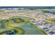 Aerial view of community with lake and homes at 32298 Wetland Bird Vw, San Antonio, FL 33576