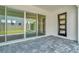 Glass doors open to a patio and grassy backyard at 32298 Wetland Bird Vw, San Antonio, FL 33576