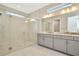 Modern bathroom with double vanity and large walk-in shower at 32298 Wetland Bird Vw, San Antonio, FL 33576