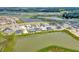 Aerial view showcasing a lake and a neighborhood of houses at 32298 Wetland Bird Vw, San Antonio, FL 33576
