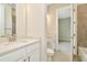 Bathroom with white vanity, toilet and bathtub at 32298 Wetland Bird Vw, San Antonio, FL 33576