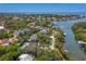 Aerial view showcasing a waterfront community with lush landscaping, private docks, and a serene coastal setting at 814 S Bayside Dr, Tampa, FL 33609