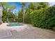 Private backyard featuring a pool, complemented by verdant landscaping that enhances privacy at 814 S Bayside Dr, Tampa, FL 33609