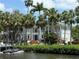 Stunning waterfront home surrounded by lush landscaping and tropical palm trees at 814 S Bayside Dr, Tampa, FL 33609