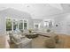 Bright and airy living room featuring a large sectional sofa and plenty of natural light at 814 S Bayside Dr, Tampa, FL 33609