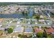 Aerial view of neighborhood with homes bordering winding waterway at 1508 Fort Duquesna Dr, Sun City Center, FL 33573