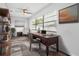 Bright home office with built-in shelving, large window, and workspace at 1508 Fort Duquesna Dr, Sun City Center, FL 33573