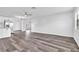 Spacious living room showcasing light grey walls and vinyl flooring at 1508 Fort Duquesna Dr, Sun City Center, FL 33573
