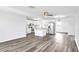 Modern kitchen with white cabinets, granite countertops and stainless steel appliances at 1508 Fort Duquesna Dr, Sun City Center, FL 33573