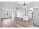Open concept living space with modern kitchen and stainless steel appliances at 1508 Fort Duquesna Dr, Sun City Center, FL 33573