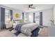 Spacious bedroom with a king-size bed and blue color scheme at 1508 Fort Duquesna Dr, Sun City Center, FL 33573