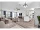Open living room and kitchen with modern appliances and flooring at 1508 Fort Duquesna Dr, Sun City Center, FL 33573