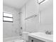 Clean bathroom with marble tile, a shower/tub combo, and modern vanity at 1508 Fort Duquesna Dr, Sun City Center, FL 33573