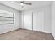Cozy carpeted bedroom with double door closet and ceiling fan at 1508 Fort Duquesna Dr, Sun City Center, FL 33573