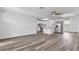 Bright living area featuring wood-look vinyl flooring and an open layout at 1508 Fort Duquesna Dr, Sun City Center, FL 33573
