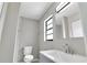 Updated bathroom with gray vanity and a window at 1508 Fort Duquesna Dr, Sun City Center, FL 33573